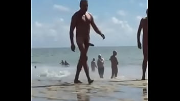 Crown with huge cock walking on the beach
