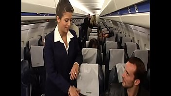 Sexy flight attendant Alyson Ray takes passenger's hard cock in her perfect ass swallows a lot of his cum after the flight