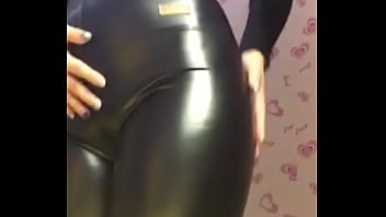 The beautiful buttocks of the female leader in leather pants