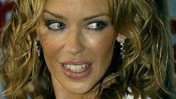 Kylie Minogue Busty In A See-Thru White Dress 02