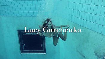Lucy strips underwater and shows hairy vagina
