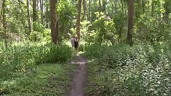 A young guy fucks an adult lady with nice tits right in the forest with her husband