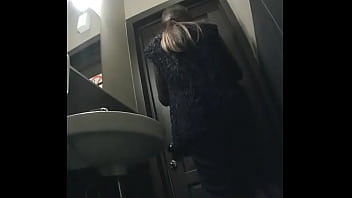 Pretty women piss on camera in a public toilet