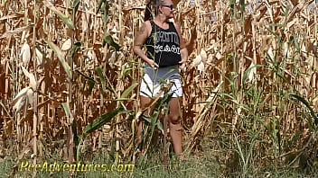 Chubby girl really needs to empty her bladder so she went into a corn field and pee with a big jet. PA211
