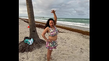 Mature Latina teasing guys in public at the beach.