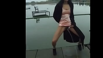 Girl lifts her dress and pees