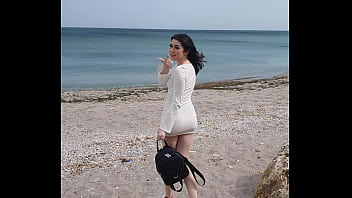 having lots of orgasms with lush toy on public beach and walking around with toy in her tight pussy