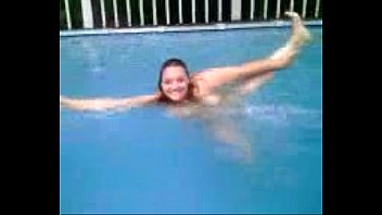 Fat woman swimming in pool